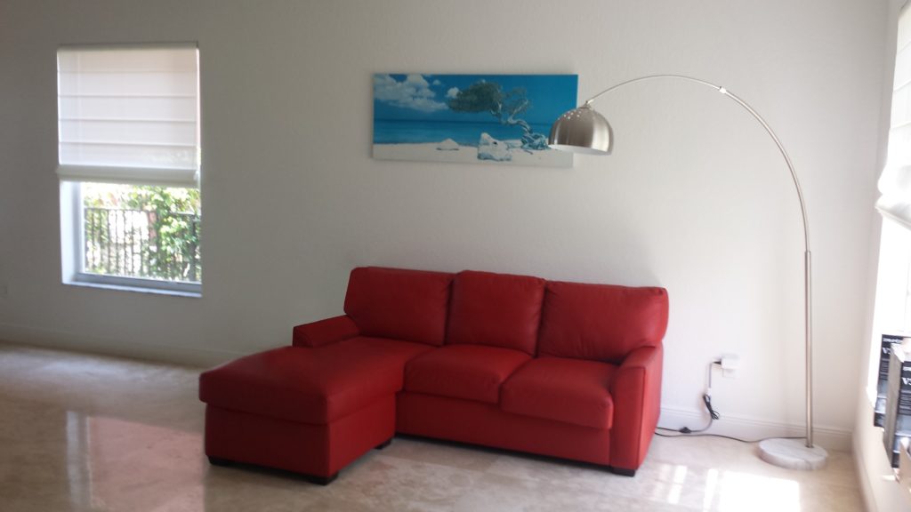 Before Photo with Red Sofa in Living Room