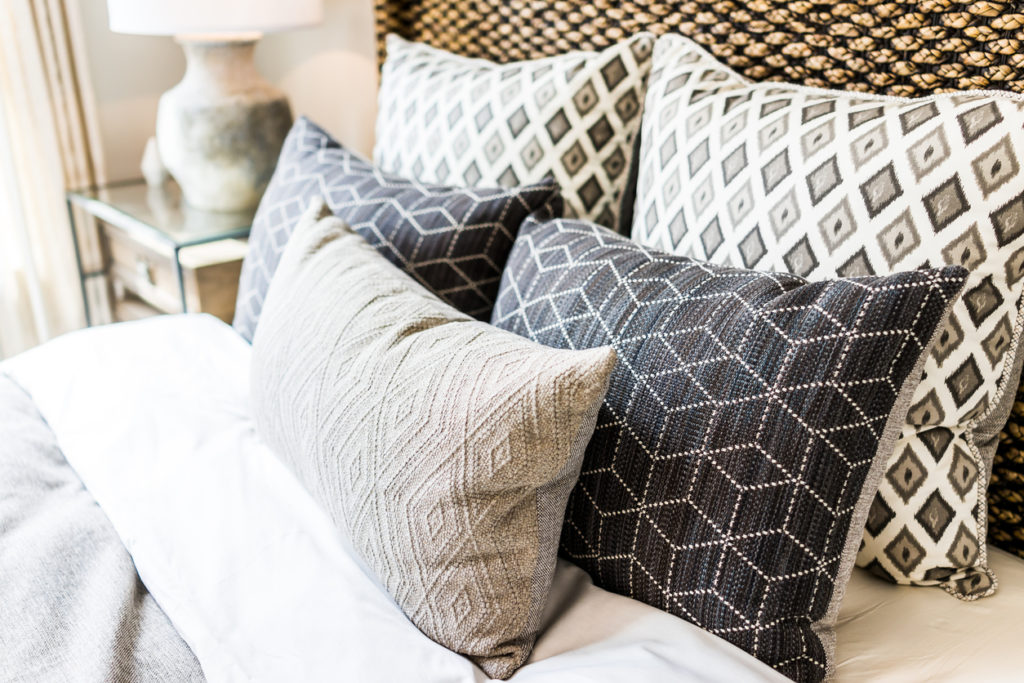 Patterned Pillows on Bed